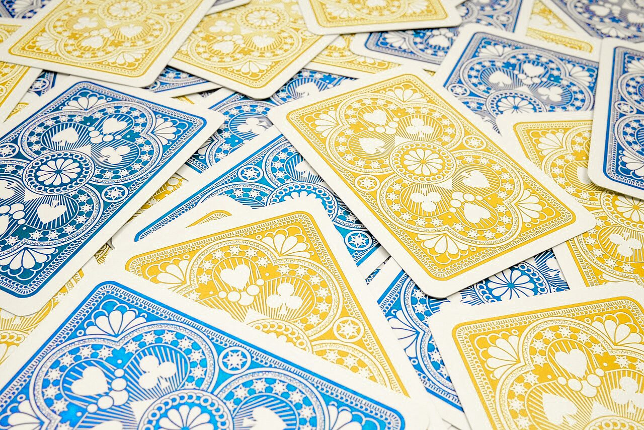 https://rmhbc.ca/wp-content/uploads/2024/04/Poker-blue-and-yellow-cards.jpg